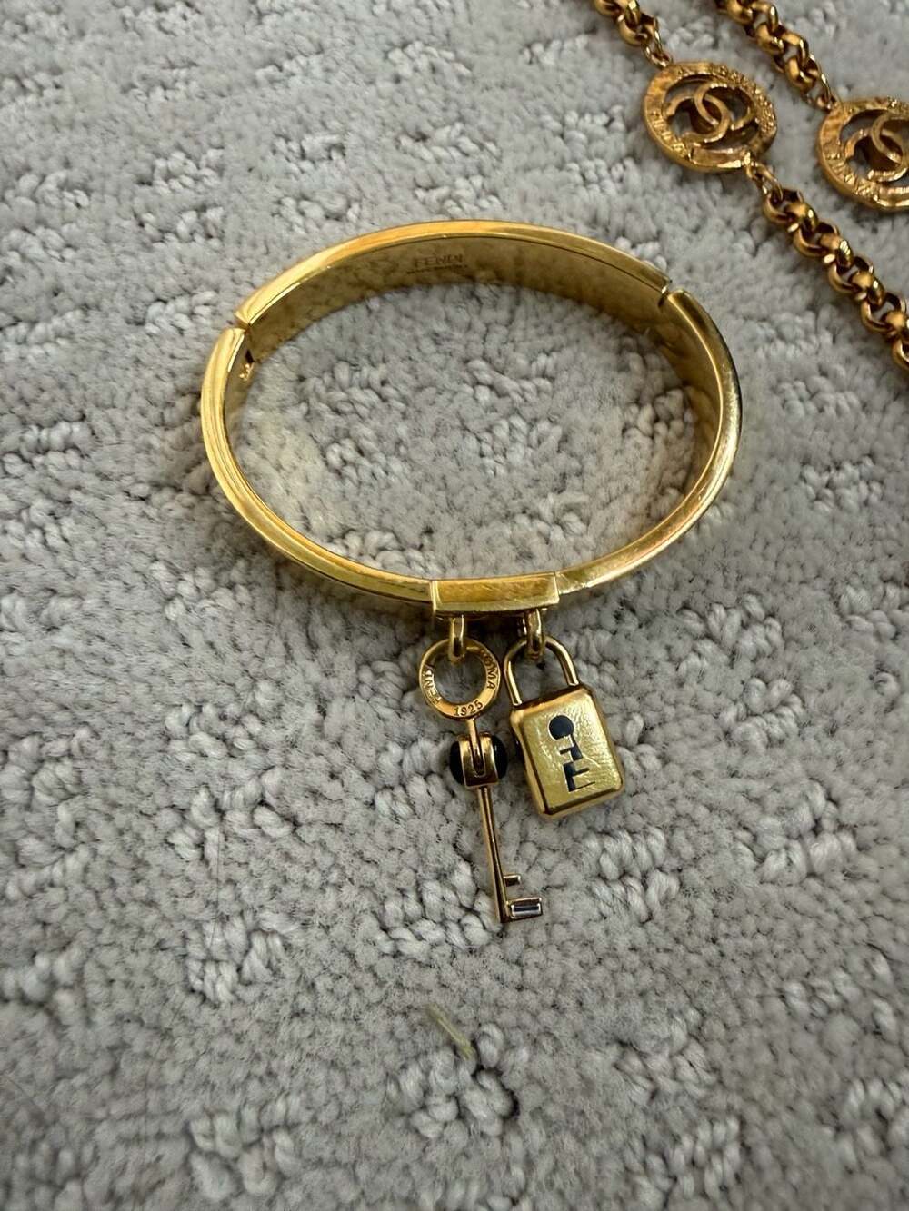 Fendi Gold Tone Lock and Key Charm Bangle Bracelet